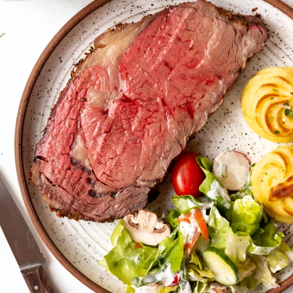 Fresh Horses Saloon's prime rib with a side of salad and duchess potatoes.